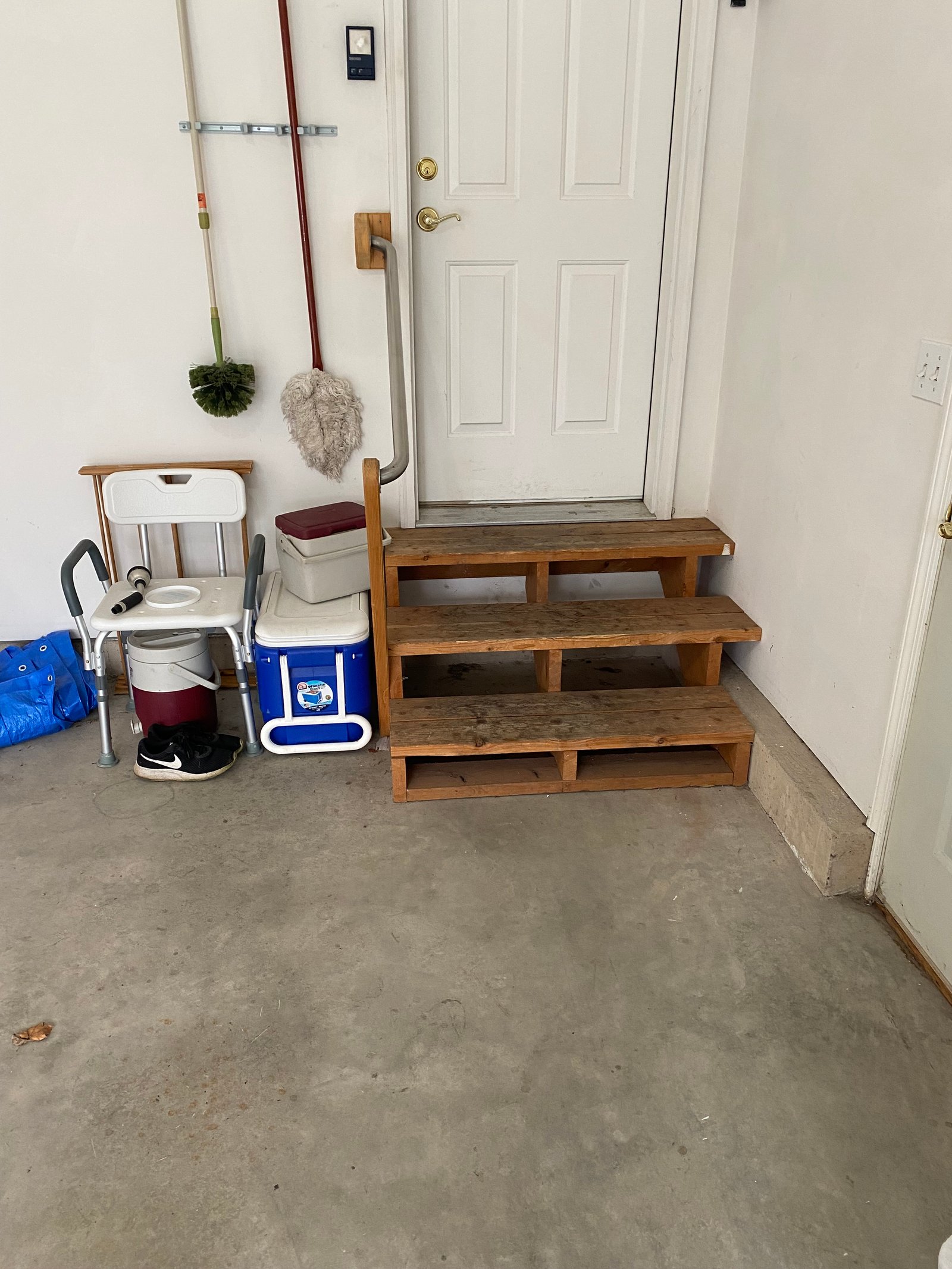 Before photo of old worn stairs before ramp replacement